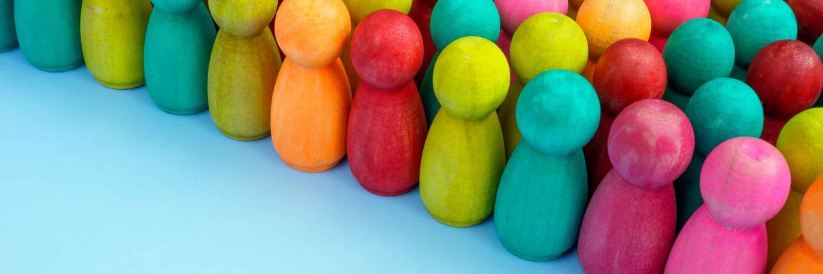 Crowd of colored figures as a symbol of diversity and inclusion.
